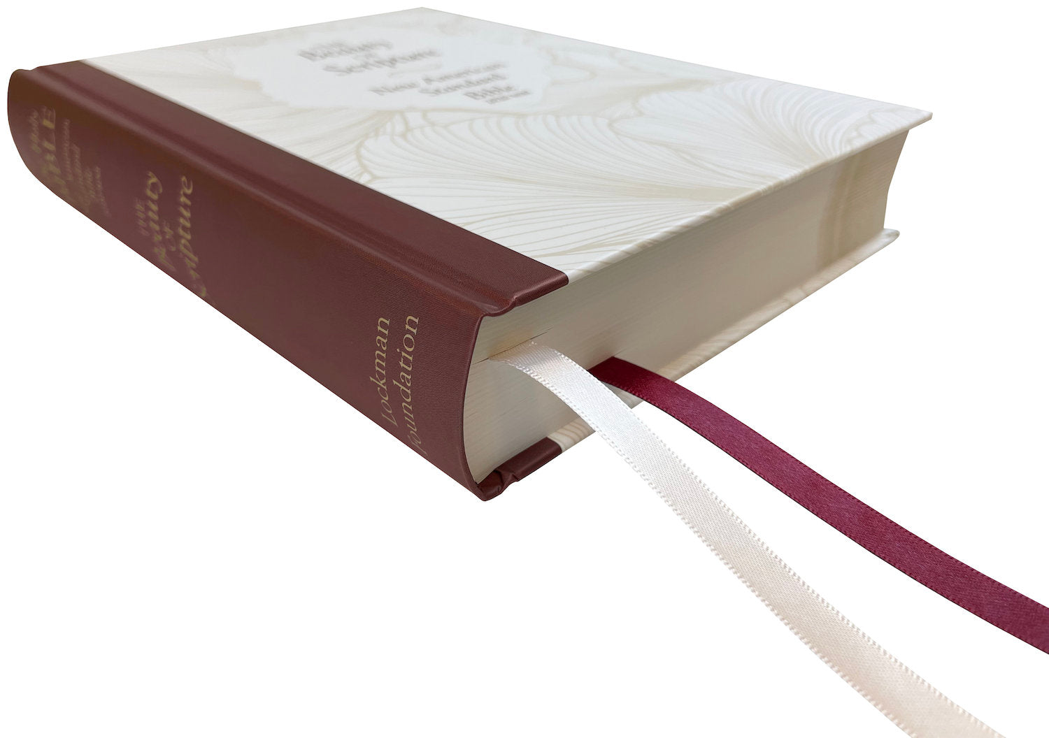 NASB 2020 Beauty of Scripture Bible, cream and burgundy hardcover with special floral design, angled side view with ribbon markers