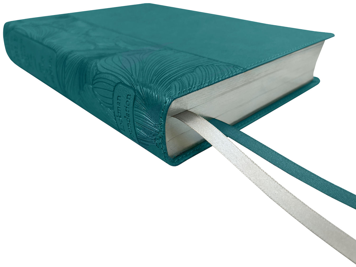 NASB 2020 Beauty of Scripture Bible, teal leathertex cover with special floral design, angled side view with ribbon markers